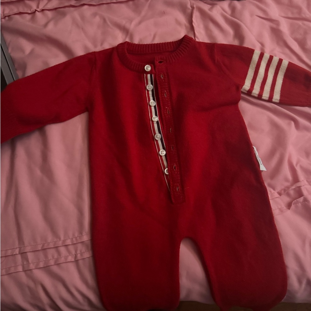 Thom Browne 
Cashmere red onesie